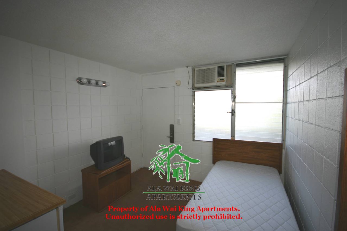 Furnished studio apartment with bed and TV